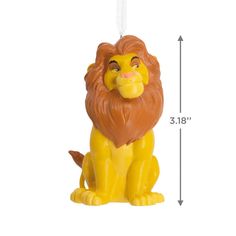 a yellow lion ornament hanging from a string