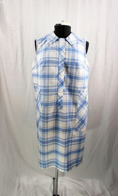 "The blue and white plaid in this amazing dress/housedress/duster is a crisp, clean color combination that would be perfect for anything from running errands to hanging out at a barbecue to staying home and being a slug on the couch. The sleeveless style and lightweight fabric would be welcome in the heat of the summer, and the fact that there is no belt or elastic anywhere is nothing but a plus in my book. The fabric is lightweight and somewhat see-through (a slip of some kind may be needed). A Sleeveless Fitted Plaid Dress For Daywear, Collared Gingham Dresses, Fitted Sleeveless Plaid Dress For Daywear, Sleeveless Plaid Dress For Daywear, White Fitted Plaid Dress For Daywear, Retro Plaid Dress For Daywear, Sleeveless Plaid Dress With Pockets, White Sleeveless Cotton Plaid Dress, Collared Cotton Plaid Dress