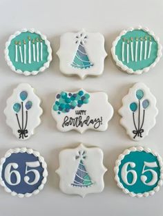 decorated cookies are arranged in the shape of happy birthdays with blue and green decorations