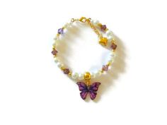 "A adorable little butterfly bracelet for the butterfly lover. This item is made of glass pearls with amethyst bicones, a beautiful butterfly charm all strung on wire and closes with a lobster clasp. There is a one inch growth chain with a small heart attached to the end of the bracelet. This item comes with a gift card and enclosed in a organza gift bag. If this item is for a flower girl you can choose a poem/quote from the following link: https://www.etsy.com/listing/259149538/20-sample-flower Bracelet Butterfly, Flower Girl Bracelets, Little Butterfly, Bracelet Pearl, Butterfly Bracelet, Flower Girl Gifts, Great Birthday Gifts, A Poem, Purple Butterfly