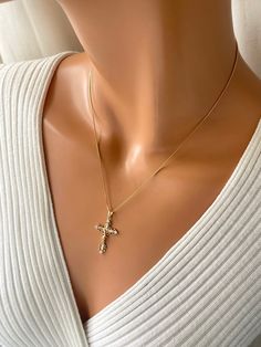 This is a 18kt gold-filled ornate crucifix cross pendant necklace.  Shown on a shiny 18kt gold filled box chain that measures 18" length.  his beautiful crucifix measures 35x20mm with bale. Please not that 18k gold filled is deeper in gold color, almost a pinkish gold.  Ships in a cute gift box ready to present. Gold filled jewelry is an actual layer of gold pressure bonded to another metal. Gold filled is not to be confused with gold plating as filled has 100% more gold than gold plating. Gold filled is much more valuable. Anyone that can wear gold, can wear gold filled jewelry without worries of an allergic reaction.  Gold-filled items are generally considered lifetime products and the gold layer will not wear off, as it will with gold-plated products. Cross Charm Necklace, Crucifix Necklace, Catholic Jewelry, Jesus Cross, Cute Gift Boxes, Gold Box, Charm Necklaces, Cross Charms, Cross Pendant Necklace