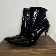 Versace Black Patent Leather Heels These Booties Are Killer!!! I Did Some Research & Can't Find Another Pair! Super Unique, Sexy & Edgy! Best Guess At Age Is 2010s Condition- Few Scuffs On Bottom Soles And Couple Tiny Scratches On Heel Insole- 9.5" Toebox- 3" Heel- 4" Total Height- 9" Luxury Metallic Evening Boots, Elegant Shiny Boots For Formal Occasions, Elegant Shiny Formal Boots, Elegant Formal Shiny Boots, Metallic High Heel Boots For Formal Occasions, Elegant Shiny Black Boots For Evening, Elegant Shiny Black Evening Boots, Versace Shoes, Patent Leather Heels