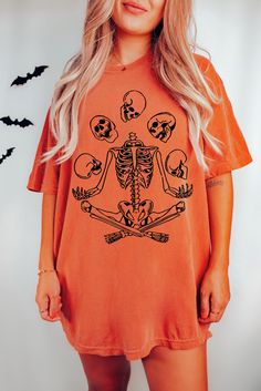 Yoga Skeleton Tee Comfort Colors® Funny Halloween Tshirt Overstimulated Shirt Skulls Shirt Cute Spooky Seaon Gothic Aesthetic VSCO T Shirt  Shop all The June Kind - https://www.etsy.com/ca/shop/TheJuneKind? ---------- Please read before placing your order -------------- 1. This apparel is GENDER NEUTRAL / UNISEX. The relaxed fit is flattering for all bodies. 2. Refer SIZE CHART for measurements. Upsize for oversized looks. 3. This listing for Comfort Colors 1717 Unisex 100% cotton tees - soft wa Spooky Skull Print Tops For Fall, Spooky Skull Print Fall Top, Fall Skull Print Short Sleeve Tops, Spooky Short Sleeve Top With Screen Print, Spooky Skull Print Top For Fall, Fall Skull Print Short Sleeve T-shirt, Halloween Grunge Short Sleeve Tops, Skull Print Short Sleeve T-shirt For Fall, Short Sleeve T-shirt With Skull Print For Fall