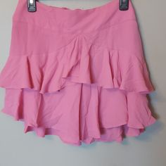 Nwt Express Ruffled Skirt Size 10 Sooo Cute Ladies! I Purchased & Didn't Need It Was Bought 01/21. It Is Pink With Three Layers Of Ruffles Very Soft Lightweight With A Type Of Satin Layer Underneath. Zip Partial In The Back With A Hook & Eye Closure As Pictured. Bow In The Back As Well! High Waist Relaxed Mini Skirt With Ruffles, High Waist Mini Skirt With Ruffles, High Waist Ruffled Skort, Ruffle Hem Flared Skort, Ruffled Short Skirt For Day Out, Short Ruffled Skirt For Day Out, Short Length Ruffled Relaxed Skirt, High Waist Ruffled Mini Skirt, Feminine High Waist Ruffled Mini Skirt