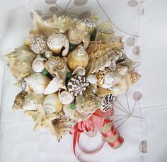 "These beautifully hand-crafted sea shell bouquets with semiprecious stones green Aventurin (A semi-precious stone that is said to be the luckiest of all crystals, especially in manifesting prosperity and wealth, or for increasing favor in competitions or games of chance. Its winning energy makes it a great ally for boosting one's chances in any situation) are perfect for all \"Beach Brides\"! These bouquets are a beautiful piece to add to your wedding day. After your special day has come to an White Shell For Wedding, Shell Bouquet, Wedding Nautical, Wedding Coastal, Manifesting Prosperity, Bouquet Bridal, Beach Bride, Coastal Wedding, Nautical Wedding