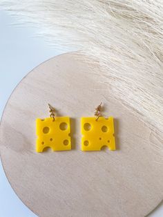 Perfect for those who love to wear their favorite foods on their sleeves--well, ears in this case! These delightful accessories are not only a quirky fashion statement but a conversation starter too. Imagine walking into a room and immediately sparking joy with your playful, food-inspired jewelry. Pair them with a pizza-themed tee or your comfiest jeans to complete the look. Remember, fashion should be as fun and flavorful as your favorite snack! Include : 1 pair of earrings These earrings are m Quirky Handmade Yellow Earrings, Quirky Yellow Jewelry For Gift, Quirky Yellow Jewelry Gift, Pizza T Shirt, Sparking Joy, Diy Earrings Polymer Clay, Quirky Jewelry, Food Inspired, Food Earrings