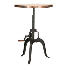 an industrial style table with wheels on the legs and a light at the top is shown