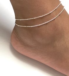 "Sterling Silver Adjustable Satellite Chain Anklet Double Layered Ankle Bracelet Minimalist and Dainty Ankle Bracelet Metal: All Components Are Made From Solid .925 Sterling Silver **Choose Size At Checkout** *Adjustable from 8\" to 9\" *Adjustable from 9\" to 10\" *Adjustable from 10\" to 11\" Please Read Store Policy Before Purchase You can find more anklets in my store here: https://www.etsy.com/shop/LinksAndStones?ref=simple-shop-header-name&listing_id=687470766&section_id=26197034 T Elegant Summer Anklets With Round Beads, Minimalist Handmade Anklets With Round Beads, Summer Silver Bracelets With Tiny Beads, Minimalist Round Bead Anklets As Gift, Minimalist Anklets With Round Beads For Gift, Minimalist Handmade Beaded Anklets, Adjustable Beaded Chain Anklet As Gift, Dainty Beaded Chain Anklets With Round Beads, Minimalist Delicate Chain Anklet For Summer