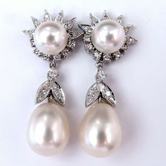 Classic Dangling South Seas Pearl Earrings. Upper Pearl: 8.7mm Lower Pearl: 13 X 11mm Excellent Aaa Luster And Sheen. .60 Carat Natural Diamonds Pave Bead Set. H Color Vs2 Clarity. 14 Karat White Gold 11.6 G. Overall Earrings Measure 14.8mm Wide 10 Mm Depth. Comfortable Butterfly Post. $8000 Appraisal Certificate To A Company Classic Bridal Earrings With 17 Jewels For Anniversary, Elegant Gia Certified Teardrop Diamond Earrings, White Platinum Dangle Diamond Earrings, White Teardrop Diamond Earrings In Platinum, White Gia Certified Diamond Earrings For Formal Occasions, Elegant Gia Certified White Diamond Earrings, Elegant White Gia Certified Diamond Earrings, Gia Certified Pear Shaped Formal Earrings, Elegant White Platinum Bridal Earrings