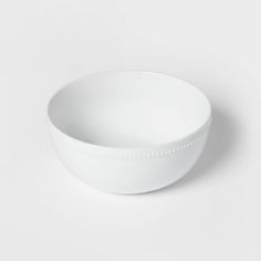 a white bowl sitting on top of a table