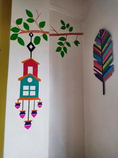 the wall is decorated with colorful birds and tree branches, as well as a birdhouse