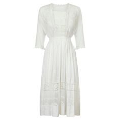 This late 1900s to early 1910s cotton whitework midi dress is in great wearable condition. Fashioned from lightweight cotton with filet lace rose design inserts throughout the chest, cuffs and hem of the dress creating a beautiful Edwardian look. Embroidered on the dress with complimentary white thread are small delicate flowers, possibly honeysuckle, and intricate squares in a circular design that have been expertly placed throughout. There is a white mesh inlay inside the top of the dress whic Filet Lace, Tea Gown, New Look Fashion, Rose Print Dress, Circular Design, Belted Shirt Dress, Delicate Flowers, Dress Satin, Lace Insert