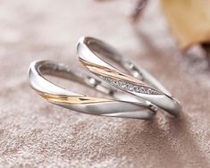 two gold and silver rings with diamonds