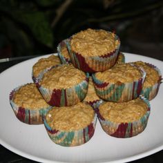 six muffins on a plate with a knife and fork in the background, ready to be eaten