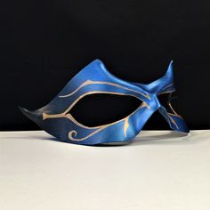 "Blue leather mask fades to black. Handpainted gold Egyptian-style design. ORDER ANY COLOR Great for any masquerade party, Renaissance Faire, Masked wedding, or Mardi Gras celebration! CosPlay Conventions, Comicon super hero costume, Halloween costume, Carnival, Masquerade ball, Renaissance Faire! WATERPROOFED, Supple leather is formed to facial contours. ADJUSTABLE: Secured with comfortable ties or adhesive. Available without holes. Scroll further down for details! MATCH YOUR COSTUME ♦ Professi Fantasy Masquerade Mask For Cosplay Events, Masquerade Eye Mask For Cosplay Events, Cosplay Events Masquerade Eye Mask, Cosplay Events Eye Mask For Masquerade Costume, Fantasy Masks For Masquerade And Cosplay Events, Fantasy Style Masks For Masquerade And Cosplay, Gold Masquerade Mask For Carnival Cosplay, Eye Mask For Cosplay And Costume Events, Eye Mask For Cosplay Events And Costumes