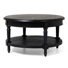 an oval coffee table with two shelves on each side and one shelf below it, in black