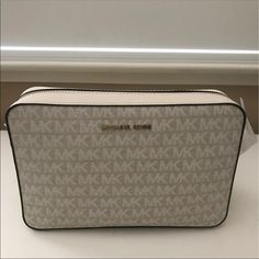 Authentic Michael Kors Large Jacquard Logo Crossbody Bag. Top-Zip Fastening, Gold-Tone Hardware, Spacious Interior Size: 9.5"W X 6.5"H X 2"D, Adjustable Strap: 22.5"-25" Interior Details: Back Slip Pocket, Front Slip Pocket Color: Nat/Lt Designer White Shoulder Bag With Zipper Closure, White Clutch Shoulder Bag With Zipper, White Clutch Shoulder Bag With Zipper Closure, White Clutch Bag With Zipper Closure, Michael Kors Cream Rectangular Shoulder Bag, Michael Kors Modern White Shoulder Bag, Modern Michael Kors White Shoulder Bag, Modern White Michael Kors Shoulder Bag, Cream Michael Kors Crossbody Shoulder Bag