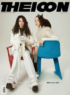 two women sitting in chairs with one holding a cat on the cover of the magazine