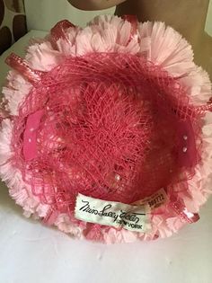 "Vintage 1950's 1960's Petite and Sweet Pink floral hat. The label is *Miss Sally Victor* New York. To keep hat on your head, you would need to use a hatpin (Not Included). *MORE INFORMATION BELOW* CONDITION: No issues noted. MEASURES: Inside circumference-16\" Front to back-6\" Left to right-6\" *WE APOLOGIZE~BUT WE NO LONGER SHIP TO GERMANY, ITALY OR SPAIN. IF ORDERS COME IN FROM GERMANY, ITALY OR SPAIN, WE WILL HAVE TO CANCEL THEM AND REFUND YOUR MONEY. SORRY FOR THIS INCONVENIENCE*" Vintage Pink Mini Hat For Party, Vintage Pink Hat For Evening, Vintage Pink Evening Hat, Pink Retro Party Hats, Vintage Pink Mini Hats For Vintage Events, Pink Vintage Mini Hats For Vintage Events, Vintage Pink Mini Hats For Kentucky Derby, 1960s Hats, Vintage Clothing Boutique