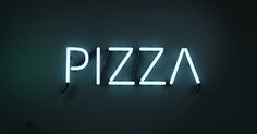 a neon sign that says pizza on it