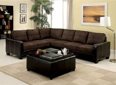 a living room with a sectional couch and coffee table