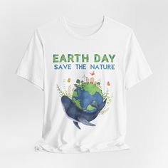 Celebrate Earth Day with our 'Save the Nature' t-shirt design, a homage to environmental stewardship. Wear it proudly as a reminder to protect our planet and preserve its natural beauty for future generations. This classic unisex jersey short sleeve tee fits like a well-loved favorite. Soft cotton and quality print make users fall in love with it over and over again. These t-shirts have-ribbed knit collars to bolster shaping. The shoulders are tapered for a better fit over time. Dual side seams Earth Day Short Sleeve Top With Letter Print, Short Sleeve Graphic Print Tops For Earth Day, Eco-friendly Short Sleeve T-shirt With Letter Print, Earth Day Graphic Tee With Letter Print, Eco-friendly Short Sleeve T-shirt, Earth Day Graphic Print Short Sleeve Top, Earth Day Screen Print Short Sleeve Tops, Eco-friendly Graphic Tee With Short Sleeves, Casual Graphic Print Shirt For Earth Day