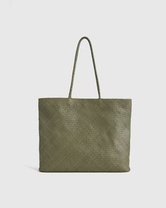 Our Italian Leather Handwoven Tote is a timeless classic with an eye-catching design. Handcrafted from luxurious top-grain Italian leather, this tote features a roomy interior with a zippered pocket and a two slip pockets, making it practical enough for everyday use. You won't regret adding this elegant piece to your handbag collection. Expensive Purses, Woven Leather Tote, Soft Beauty, Bezel Necklace, Handbag Collection, Black Camel, Beautiful Handbags, Sell Gold, Purses Designer