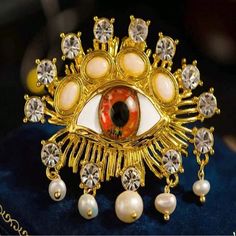 Eye Shaped Brooch * Color: Red, Rhinestone, Gold * Zinc Alloy Gold Party Brooch Pin, Gold Jeweled Brooches For Party, Gold Rhinestone Pins For Party, Gold Rhinestone Party Pins, Red Rhinestone, Eye Shapes, Evil Eye, Zinc Alloy, Brooches