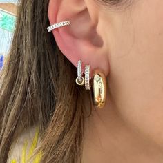 I pair these stunning huggies with the matching ear cuff. They're so elegant and shiny. Prong settings are one of my favorite styles and this sparkle proves it! Available in 14k yellow, rose, or white gold .53ctw diamond Outer diameter measures 15mm Inner diameter measures 10.5mm By EF Collection Diamond Halo Huggie Earrings, Baguette Diamond Small Hoop Huggie Earrings, Yellow Gold Diamond Huggie Earrings With Halo, Yellow Gold Huggie Diamond Earrings With Halo, Yellow Gold Cubic Zirconia Huggie Cartilage Earrings, Small Hoop Yellow Gold Earrings With Baguette Diamonds, Small Hoop Earrings In Yellow Gold With Baguette Diamonds, Rose Gold Cubic Zirconia Huggie Earrings, Everyday Huggie Hoop Earrings With Baguette Diamonds