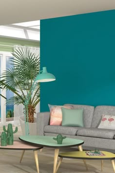 the living room is decorated in pastel colors and features flamingos on the wall