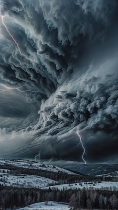 a storm is coming in over a snowy field