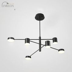 a black chandelier with five lights hanging from it