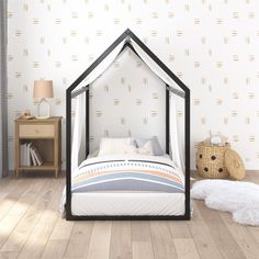 a bed with a canopy in the middle of a room next to a teddy bear