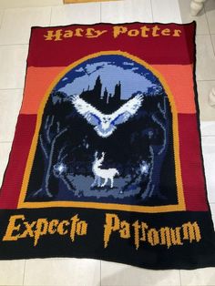 a harry potter blanket is on the floor