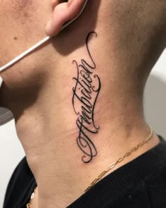 a man with a tattoo on his neck