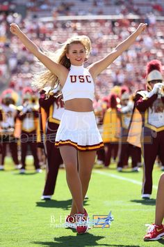 the cheerleaders are performing for the crowd