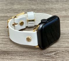 High Quality Pearl White Genuine Leather Bracelet. Designed And Handmade by Simeon D Jewelry Studio. Adjustable Size Bracelet Perfectly Tailored for Your Wrist - Plus Sizes Available! This Bracelet Fits ALL Apple Watch Series. Please Measure Your Wrist Before Submitting Your Order! Not For Other Models. Apple Watch Is NOT Included. Let's be Friends! Follow my Studio on Social Media Instagram @simeondjewelry Pinterest @simeondjewelry Facebook @simeondjewelrystudio Create Your Own Unique Style! Be Adjustable White Apple Watch Band For Everyday, White Adjustable Watch Accessories For Everyday Use, Luxury Adjustable White Apple Watch Band, Luxury White Adjustable Apple Watch Band, Adjustable White Apple Watch Bracelet Strap, Adjustable Rectangular Watch With Black Band, Adjustable White Bracelet Strap Apple Watch Band, White Watch Band With Bracelet Strap, Rectangular Watch With Adjustable Black Band