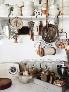 pots and pans are hanging on the wall