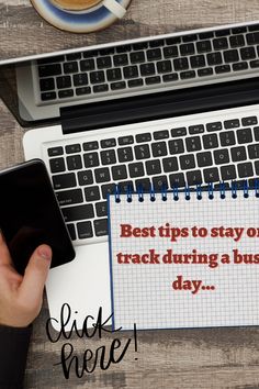 a person holding a cell phone next to a notebook with the words best tips to stay on track during a busy day