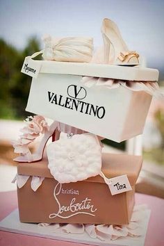 a cake that is sitting on top of a box with shoes and bags in it