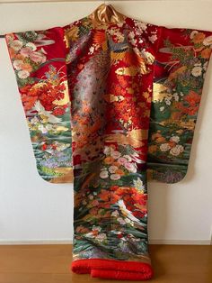 The ancient beauty of Japan can be enjoyed from various angles in this uchikake. The vivid colors of this piece add a touch of color to your special day. Height (from the back) about 180 cm Length from sleeve to sleeve: about 65 cm Condition:Please see photos. ☆ This is a very gorgeous Uchikake. This is the highest rank of Japanese kimono, so it is recommended as a gift. The gorgeous patterns and embroidery can be used as a decoration for Japanese room interior ☆ Thank you for visiting my page. My store owns a lot of unique items that you won't see in other stores. You won't regret it! Please see photos for details. If you have any questions, feel free to ask me. Elegant Red Kimono For Wedding, Traditional Red Kimono For Tea Ceremony, Traditional Red Silk Kimono, Traditional Red Kimono For Wedding, Maiko Kimono, Kabuki Costume, Flying Crane, Beauty Of Japan, Japanese Room