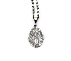 This necklace is made of 925 sterling silver with Surah Al Kalam 51-52 (Nazar Ayats) inscription which is an accessory that cannot be separated from those who want to carry it on. This necklace is a meaningful way to express spiritual feelings and will give you and your loved ones peace of mind. The length of silver necklace itself is 22 mm / 0.86 inch. (without loop)As with all silver women necklace models, this model is also produced by hand. There may be ± 10% deviation from the specified pro Sterling Silver Etched Necklace For Gift, Etched Sterling Silver Pendant Necklace, Etched Sterling Silver Necklace For Gift, Etched Sterling Silver Necklace Gift, Oval Necklaces With Oxidized Finish As Gift, Engraved Sterling Silver Necklace With Oval Pendant, Sterling Silver Etched Amulet Necklace, Silver Chain Medallion Necklaces For Gifts, Medallion Necklace With Silver Chain For Gifts