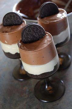 three desserts with oreo cookies and cream in them