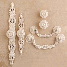 decorative wall hangings and drawer pulls in white