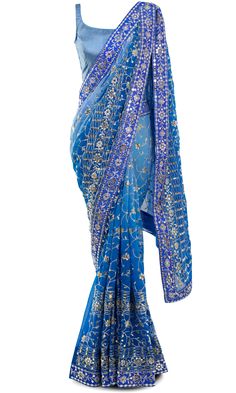 Saree is pre-stitched Saree is pre-pleated Matching underskirt is included Blouse has drawstring back for adjustability Blouse has padded inserts Stunning saree with shades of blue and shimmering silver embroidery all throughout! Blue Embroidered Pre-draped Saree For Transitional Season, Blue Bollywood Sharara For Transitional Season, Transitional Blue Georgette Blouse Piece, Festive Blue Wedding Pre-draped Saree, Fitted Blue Pre-draped Saree For Festive Occasions, Transitional Blue Sharara With Mirror Work, Blue Sharara With Zari Work For Transitional Season, Blue Georgette Choli For Transitional Season, Blue Pre-draped Saree With Mirror Work