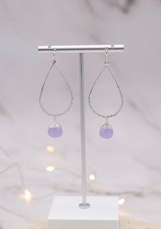 These Silver Lavender Glass drop Teardrop Earrings are a great choice for everyday wear. They are lightweight and comfortable to wear. The lavender glass drops are eye-catching, and the silver setting adds just the right amount of sparkle. Lavender Teardrop Jewelry With Ear Wire, Purple Nickel-free Teardrop Dangle Earrings, Lavender Teardrop Nickel-free Jewelry, Hypoallergenic Lavender Sterling Silver Earrings, Lavender Teardrop Earrings With Ear Wire, Purple Sterling Silver Teardrop Earrings, Hypoallergenic Purple Dangle Teardrop Earrings, Silver Wire Wrapped Teardrop Earrings, Lavender Drop Earrings