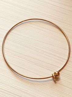 Rose Gold finish over stainless steel wire bangle bracelet - removable rose gold ball hook - add beads and charmsRemovable rose gold plated ball to easily add beads with at least 2 mm holeEasily add charmshook opens and closesRose gold plated over Stainless steel materialWon’t tarnish Bangle bracelet blankLightweightOne size fits mostInner size approx 60mm (2-1/2”) Gauge approx 1.6 mm***Although I try hard to represent actual colors, color may vary due to lighting depicted on computer monitors a Rose Gold Metal Round Bangle, Rose Gold Metal Bracelets With Round Beads, Rose Gold Metal Bracelet With Round Beads, Minimalist Rose Gold Bangle Charm Bracelet, Adjustable Rose Gold Charm Bracelet Nickel Free, Adjustable Rose Gold Metal Charm Bracelet, Wire Bangle Bracelets, Crystal Eye, Wire Bangles