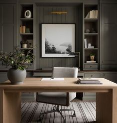 an office with gray walls and wooden furniture