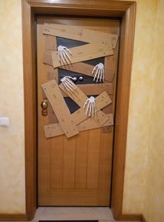 a door decorated to look like skeleton hands