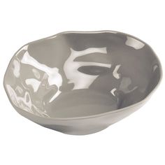 a gray and white bowl sitting on top of a table